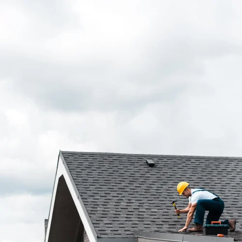 roofer-repairing-roof-with-hammer-and-toolbox-2026-03-13-01-10-50-utc